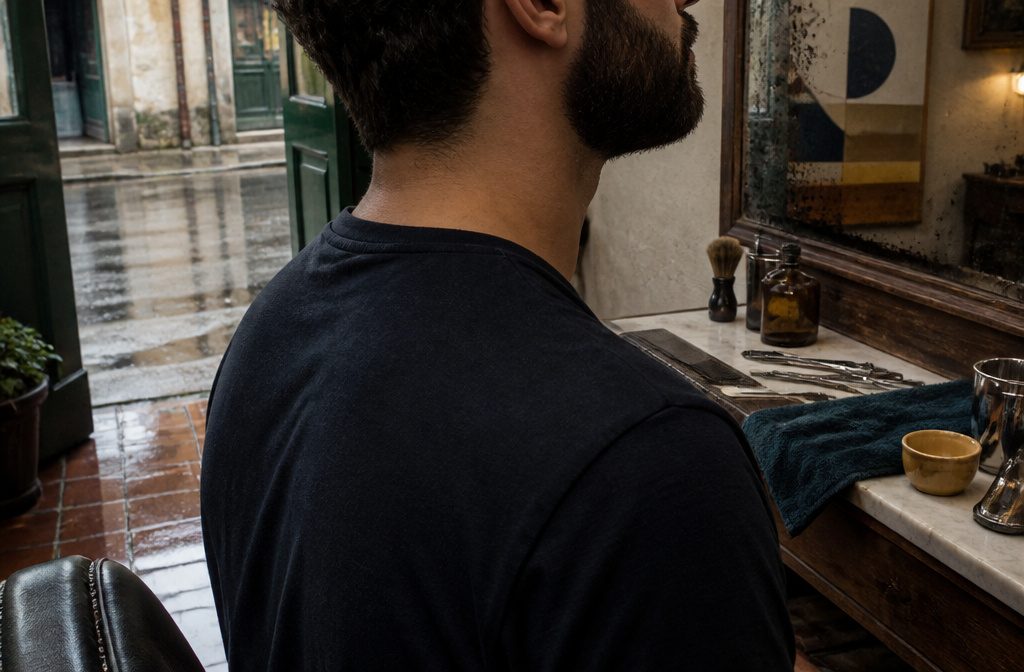 Man with a beard framed against a plain background
